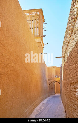 All the residential buildings in old neighborhoods of Yazd face the street with tall blank adobe walls, also serving as the fences, protecting the cou Stock Photo