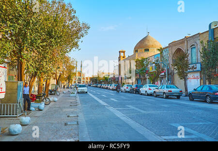 YAZD, IRAN - OCTOBER 18, 2017: Qiyam street is one of the shopping streets in old town, here the stores and stalls of Khan Bazaar are neighboring with Stock Photo