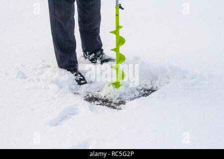 Hand Operated Ice Auger Used In Ice Fishing. Blue Metal Screw