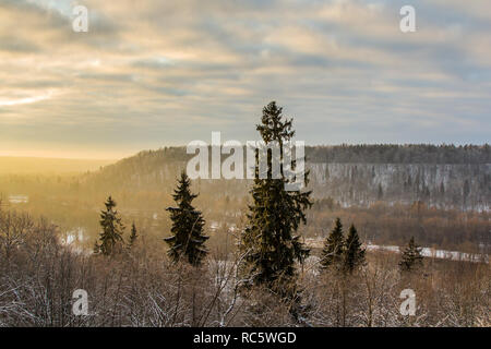 the valley of the river Gauja in winter in the rays of the sunset, landscape Stock Photo