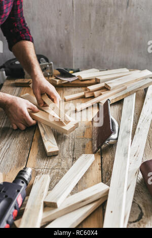 Man carpenter working in carpentry workshop Stock Photo