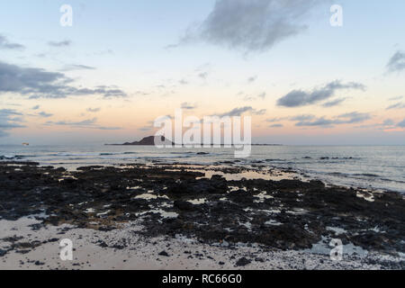 Lobos island, evening view seen from Corralejo Beach on Fuerteventura, Canary Islands, Spain Stock Photo