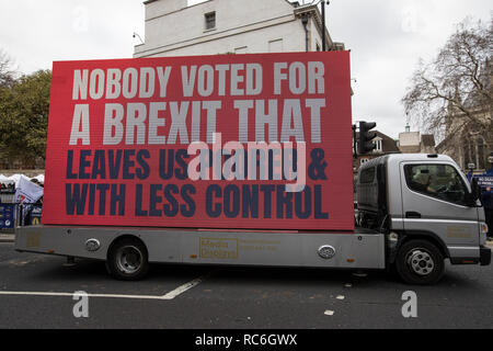 London, UK. 14th Jan 2019. Leave and Pro EU Remain supporters outside Houses of Parliament, London, UK 14th January 2019 Pro Remain suppoorters try to gather last ditch support against Brexit ahead of tomorrow's meaningful vote where Members of Parliament will approve or reject Theresa May's controversial plan. However, last month the prime minister dramatically called off the 'meaningful vote', in the face of what had been expected to be a significant defeat at the hands of rebel MPs. Credit: Jeff Gilbert/Alamy Live News Stock Photo