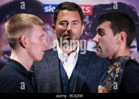 London, UK. 14th January, 2019. Boxing promoter Eddie Hearn (c) stands with Ted Cheeseman (l) and Sergio Garcia (r) at a press conference to promote their 12x3 mins European Super-Welterweight Championship fight at the 02 on 2nd February. Credit: Mark Kerrison/Alamy Live News Stock Photo