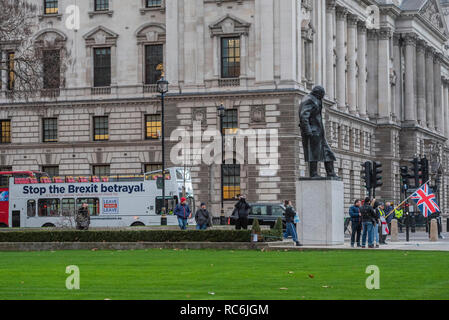 London, UK. 14th January, 2019. Leave means leave and SODEM, pro EU, protestors continue to make their points, side by side, outside Parliament as the vote on Theresa May's plan is due the next day. Credit: Guy Bell/Alamy Live News Stock Photo