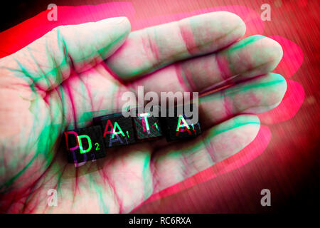 Letter cubes forming the word data on a hand Stock Photo