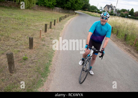 Active lifestyle for senior male cyclist, the mamil, middle aged man in lycra Stock Photo