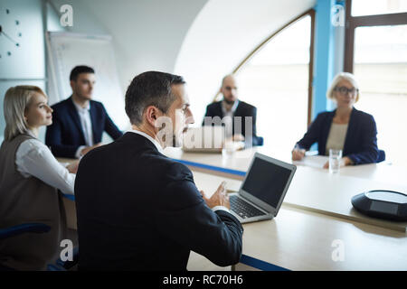 Talking to speaker Stock Photo