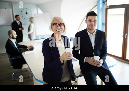 Colleagues having coffee break Stock Photo