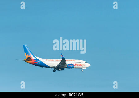 A JET2 Holidays Boeing 737 Plane with undercarriage down preparing for landing. Stock Photo