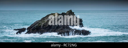 A panoramic view of The Goose a small rocky island off the coast of Newquay Cornwall. Stock Photo