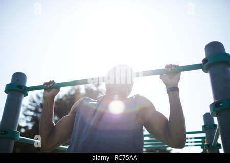 Strong black man doing workout exercise outdoors Stock Photo