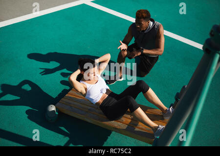 Fitness trainer giving advice to woman Stock Photo