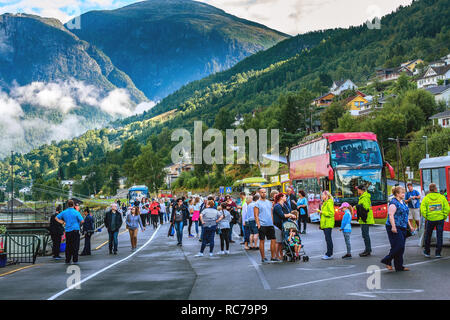 Norway, Olden - August 1, 2018: Tourist bus stop from harbour to briksdal glacier and people from cruise ship Stock Photo