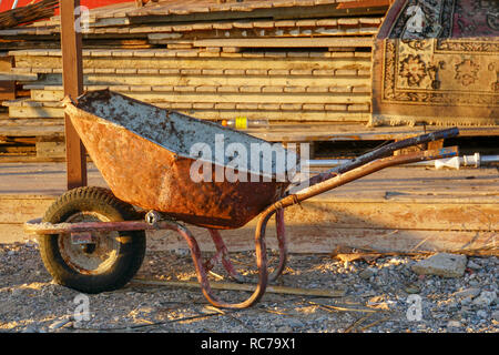 Rusty wheelbarrow in use Stock Photo