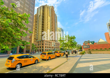 Los Angeles, California, United States - August 9, 2018: row of taxis on Grand Avenue in downtown Los Angeles, next to MOCA, the Museum of Contemporary Art in L.A. Blue sky in a sunny day. Stock Photo