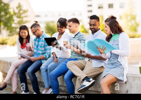 international students with notebooks outdoors Stock Photo