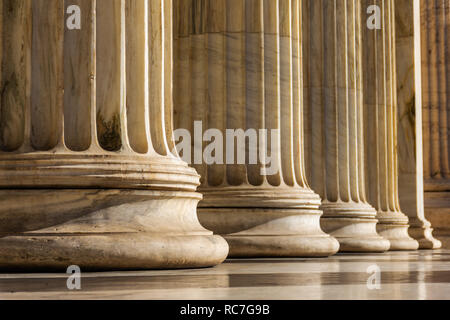 Classical marble pillars detail on the facade of National Academy of Athens, Greece Stock Photo
