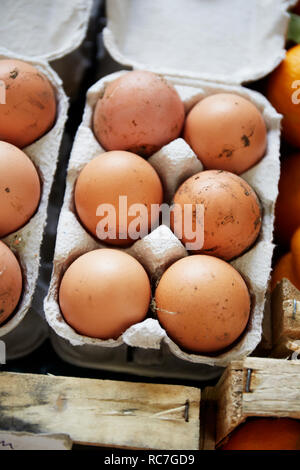 Eggs in carton on table Stock Photo
