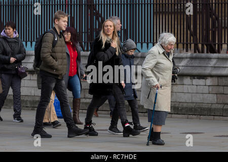 The veteran Liberal Democrat politician, Baroness Williams of Crosby, Shirley Williams, walks unnoticed by others with the aide of a walking stick towards the House of Lords, on 14th January 2019, in Westminster, London, England. Stock Photo