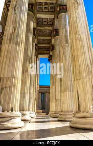 Classical marble pillars detail on the facade of National Academy of Athens, Greece Stock Photo