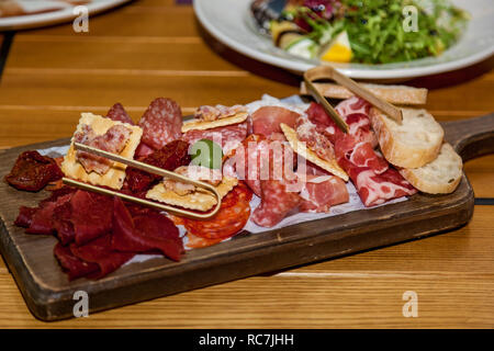 Various dishes and snacks from meat on the holiday table. Stock Photo
