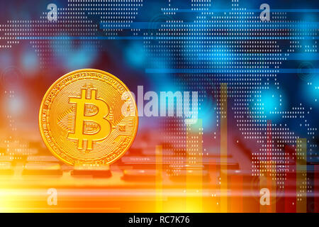 Cryptocurrency Bitcoin on keyboard with finances elements on background.  Blockchain technology concept. Stock Photo