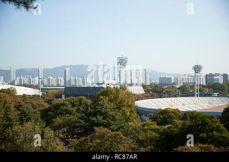 Skyline in daytime, national park and sports stadium in foreground, Seoul, South Korea Stock Photo