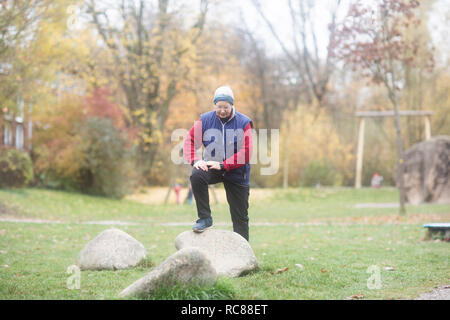 Senior woman exercising in park Stock Photo
