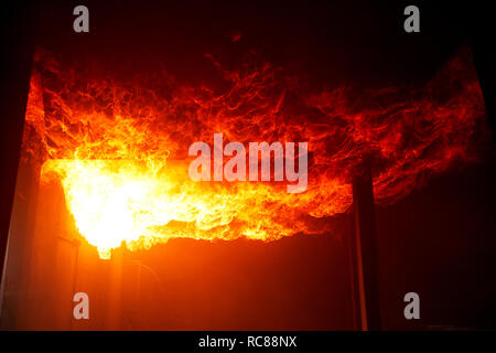 Fire raging inside building Stock Photo