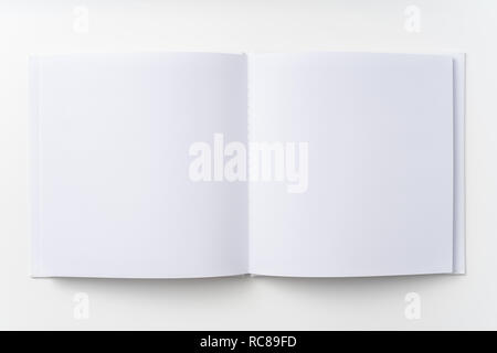 Design concept - Top view of pure white notebook, white page isolated on background for mockup Stock Photo