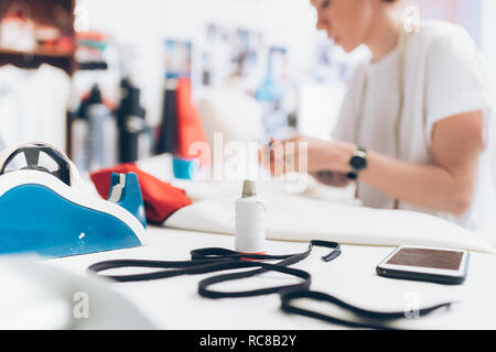 Fashion designer working in her studio Stock Photo