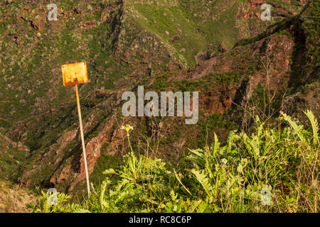 Blank rusted sign on the side of the Barranco del Tomadero  in the Anaga region of Tenerife, Canary Islands, Spain Stock Photo