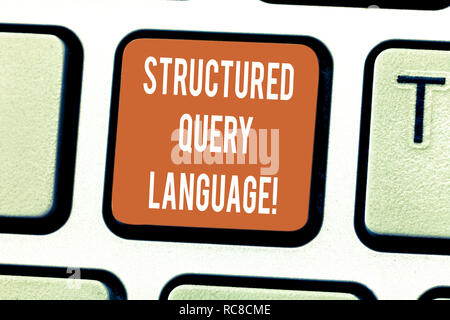 Writing note showing Structured Query Language. Business photo showcasing computer language for relational database Keyboard key Intention to create c Stock Photo
