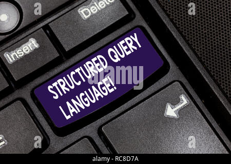 Writing note showing Structured Query Language. Business photo showcasing computer language for relational database Keyboard key Intention to create c Stock Photo