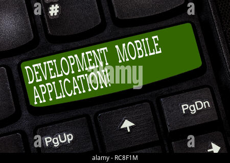 Conceptual hand writing showing Development Mobile Application. Business photo text Writing software for digital devices Keyboard key Intention to cre Stock Photo