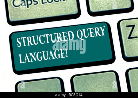 Writing note showing Structured Query Language. Business photo showcasing computer language for relational database Keyboard key Intention to create c Stock Photo