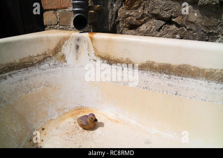 Bathtub placed in countryside and used as spring water trough, exilles,  Italy Stock Photo - Alamy