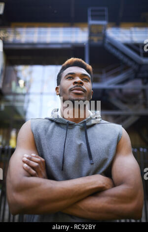 Thoughtful black man looking into distance Stock Photo
