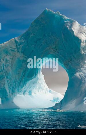 Natural arch carved in an iceberg, Antarctic Sound, Antarctic Peninsula, Antarctica Stock Photo