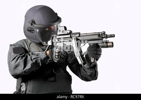 Police, Special Task Force, SEK, officer wearing full protective uniform holding a Heckler & Koch MP5 submachine gun Stock Photo