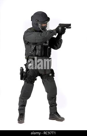Police, Special Task Force, SEK, officer wearing full protective uniform holding a Sig Sauer P6 P225 pistol Stock Photo