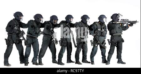 Police, Special Task Force, SEK, squad holding a metal battering ram and various weapons Stock Photo