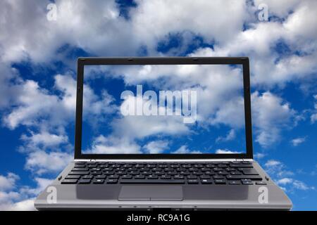 Laptop, clouds, sky, symbolic image for cloud computing, cloud Stock Photo