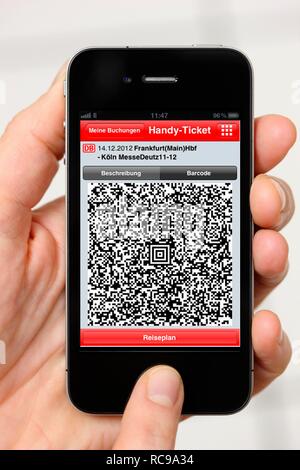 Iphone, smartphone, app on the screen, travel information, QR code-ticket of Deutsche Bahn, the German national railway company Stock Photo
