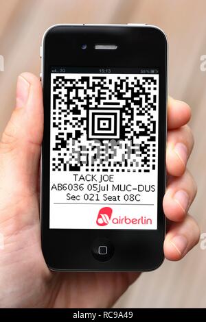 Iphone, smart phone, app on the screen, QR-Code ticket, Air Berlin boarding pass Stock Photo