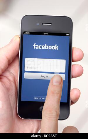 Iphone, smart phone, app on the screen, social network, Facebook Stock Photo