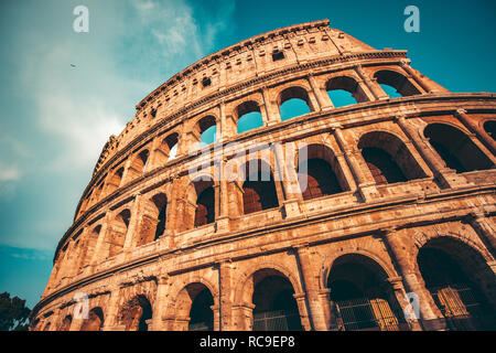 The ancient Colosseum in Rome at sunset Stock Photo