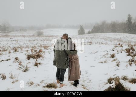 Couple enjoying snowy landscape, Georgetown, Canada Stock Photo