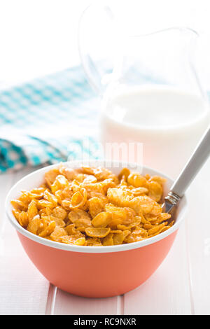 Breakfast cereals or cornflakes in bowl on white background. Stock Photo